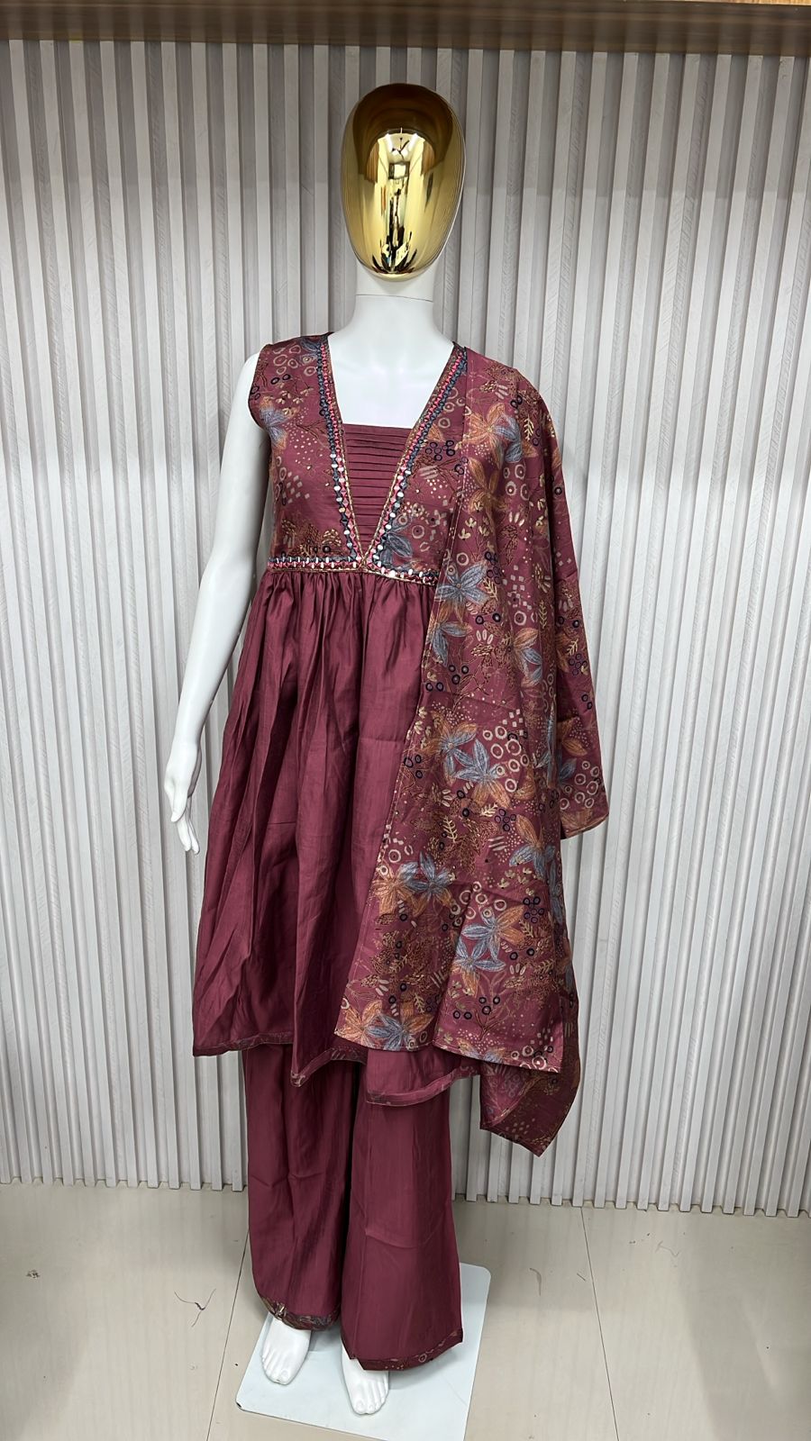 classic straight-cut kurti, with an intricately embroidered yoke