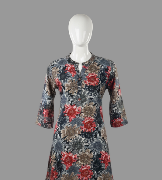 Floral patterned dress on a mannequin against a white background